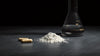Phenylpiracetam hydrazide evidence guide: gold capsules and powder on dark background by Nootropix