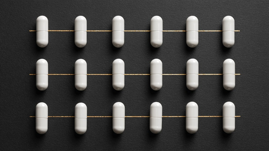 Fladrafinil evidence and safety guide: white capsules on dark background by Nootropix